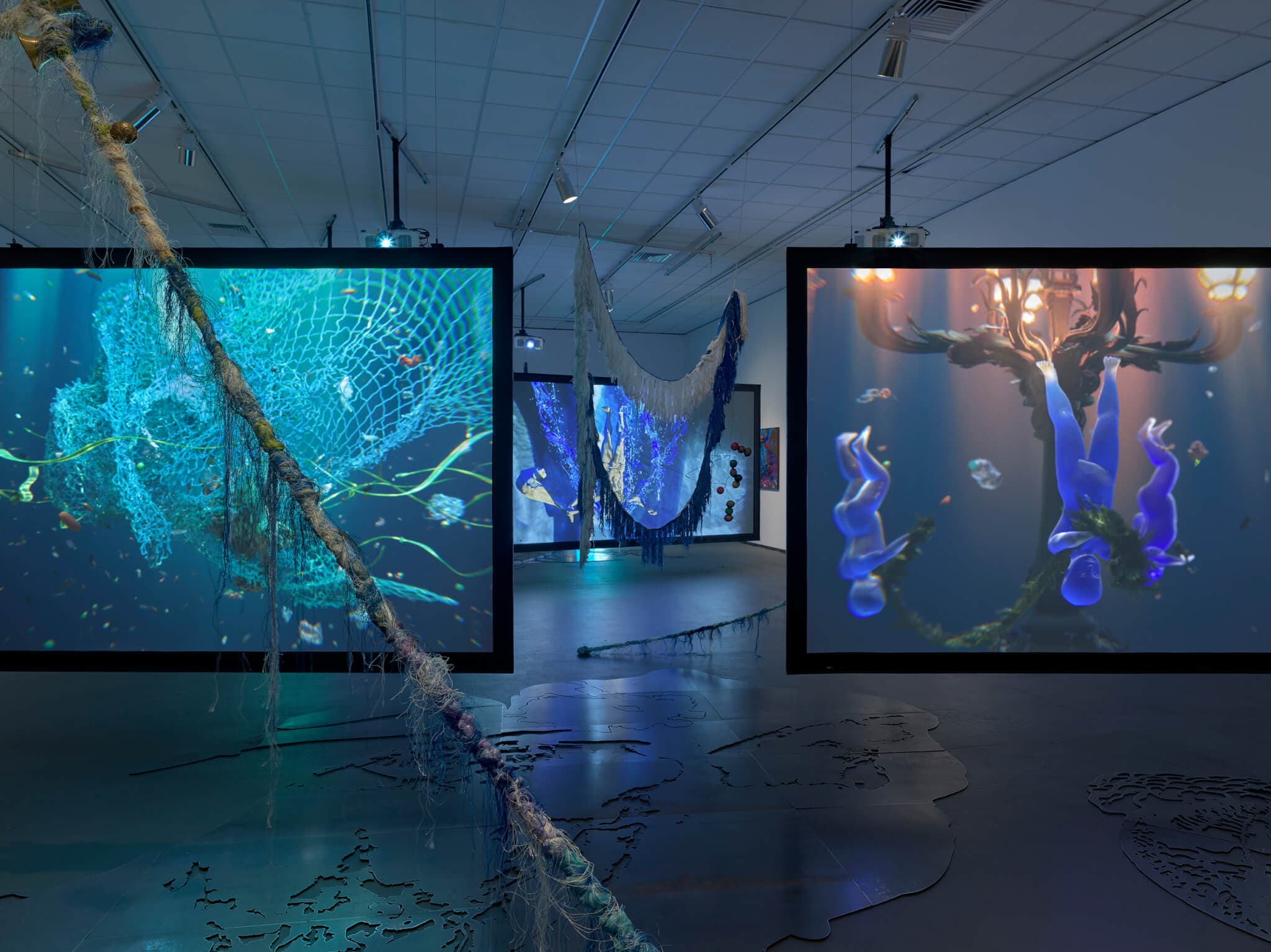 Multichannel video on hanging screens.